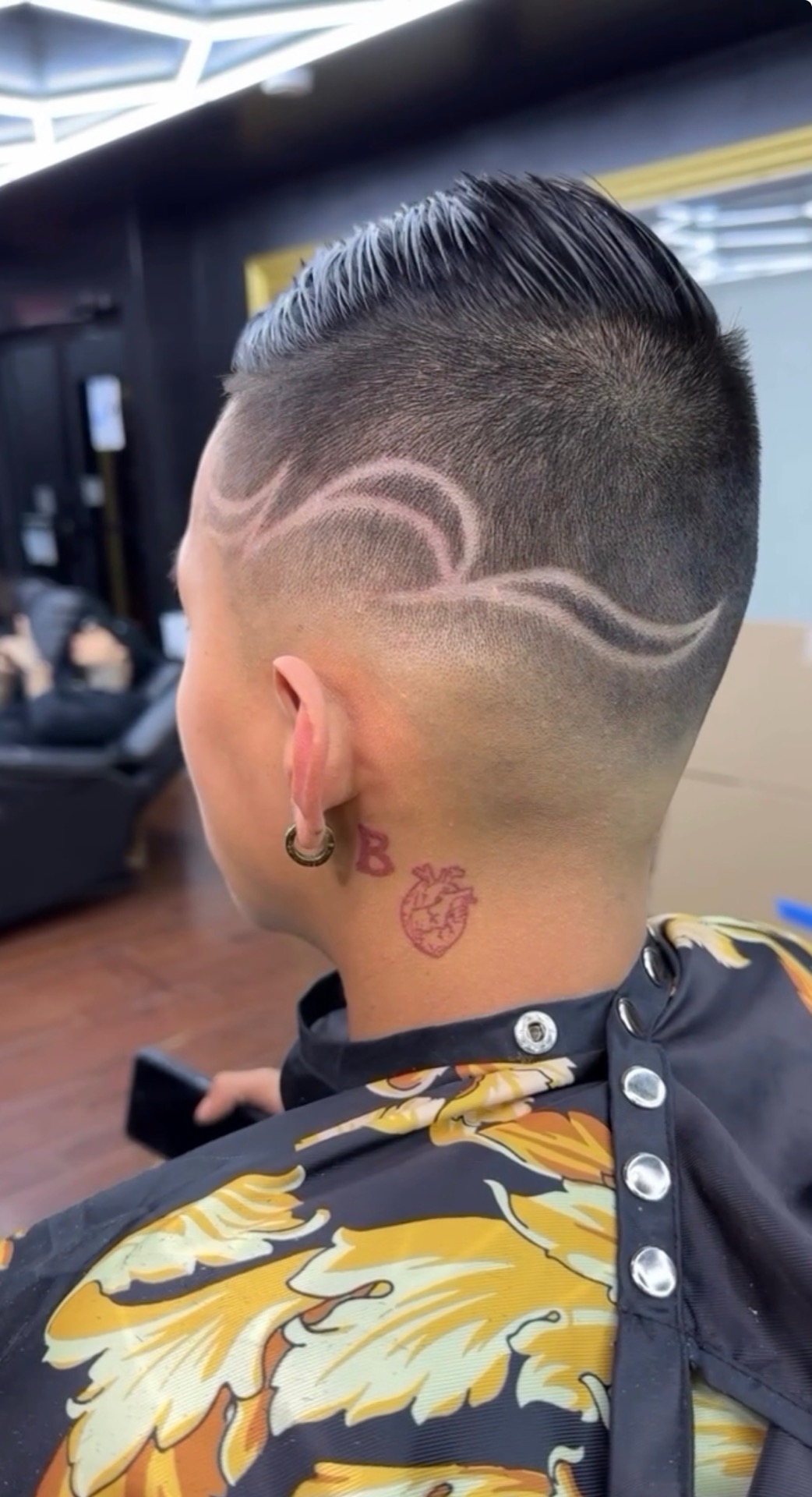 Wave scroll design on back of head